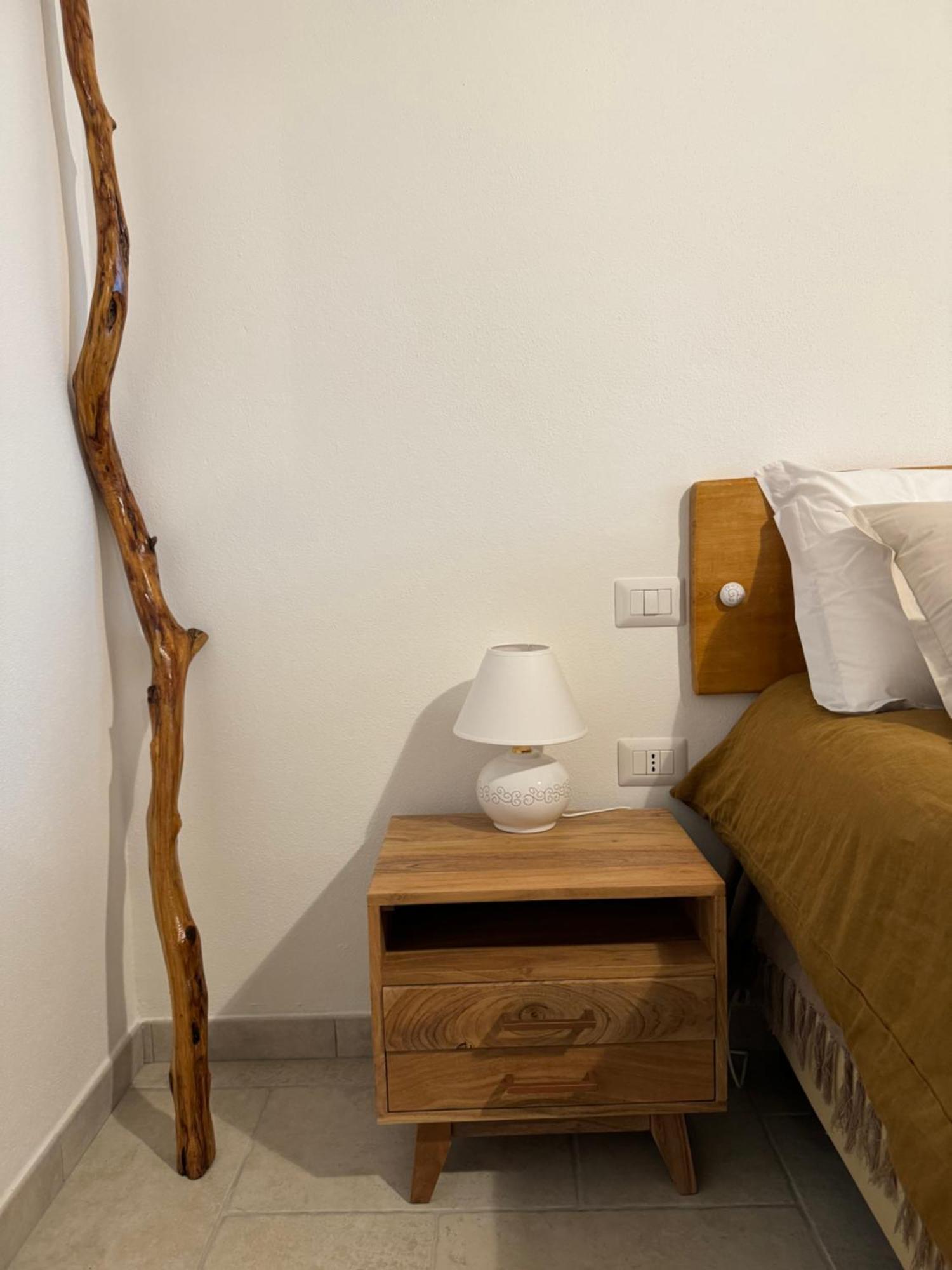 Domus La Roccia Hotel Pozzomaggiore Bagian luar foto