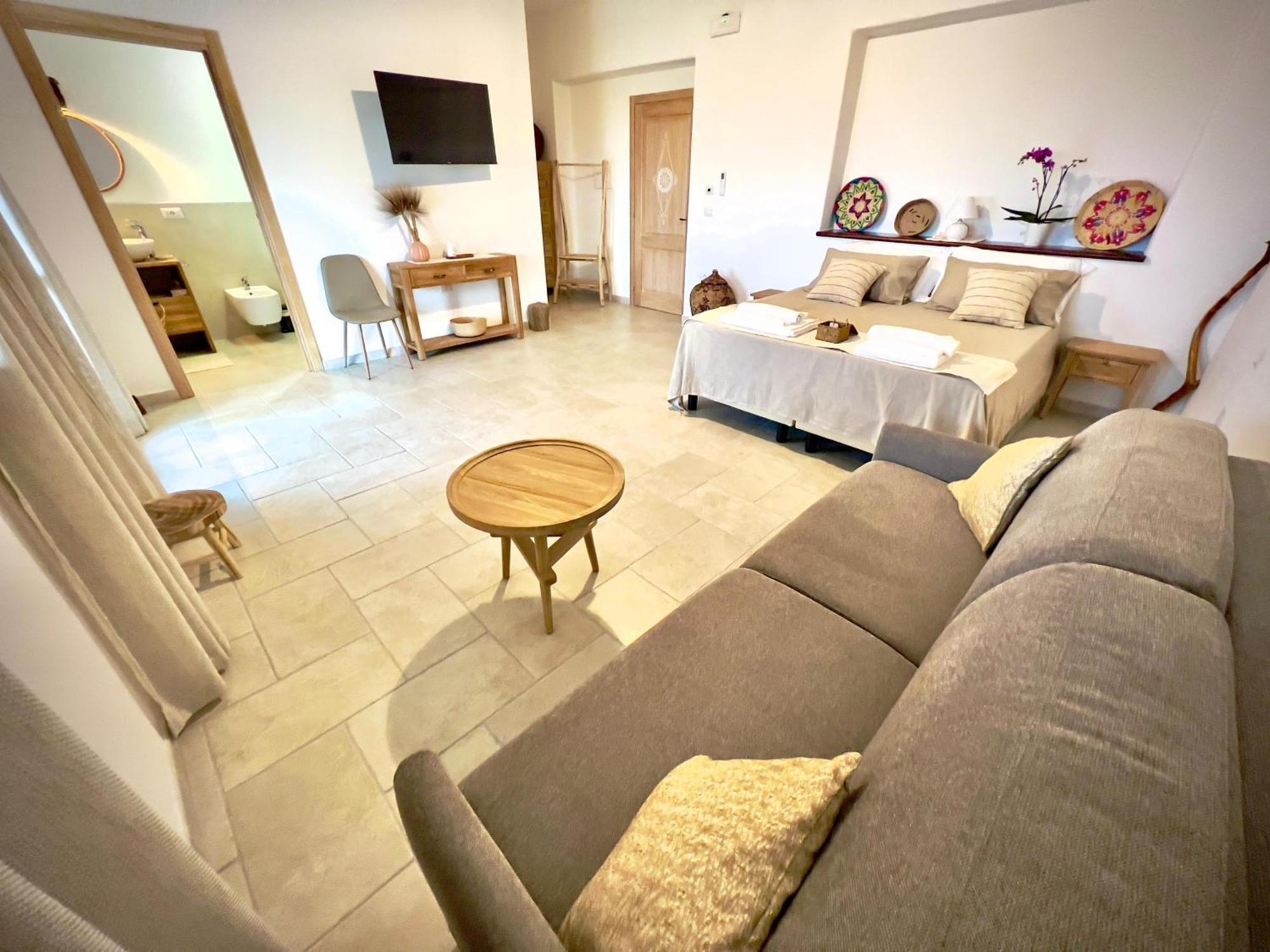 Domus La Roccia Hotel Pozzomaggiore Bagian luar foto